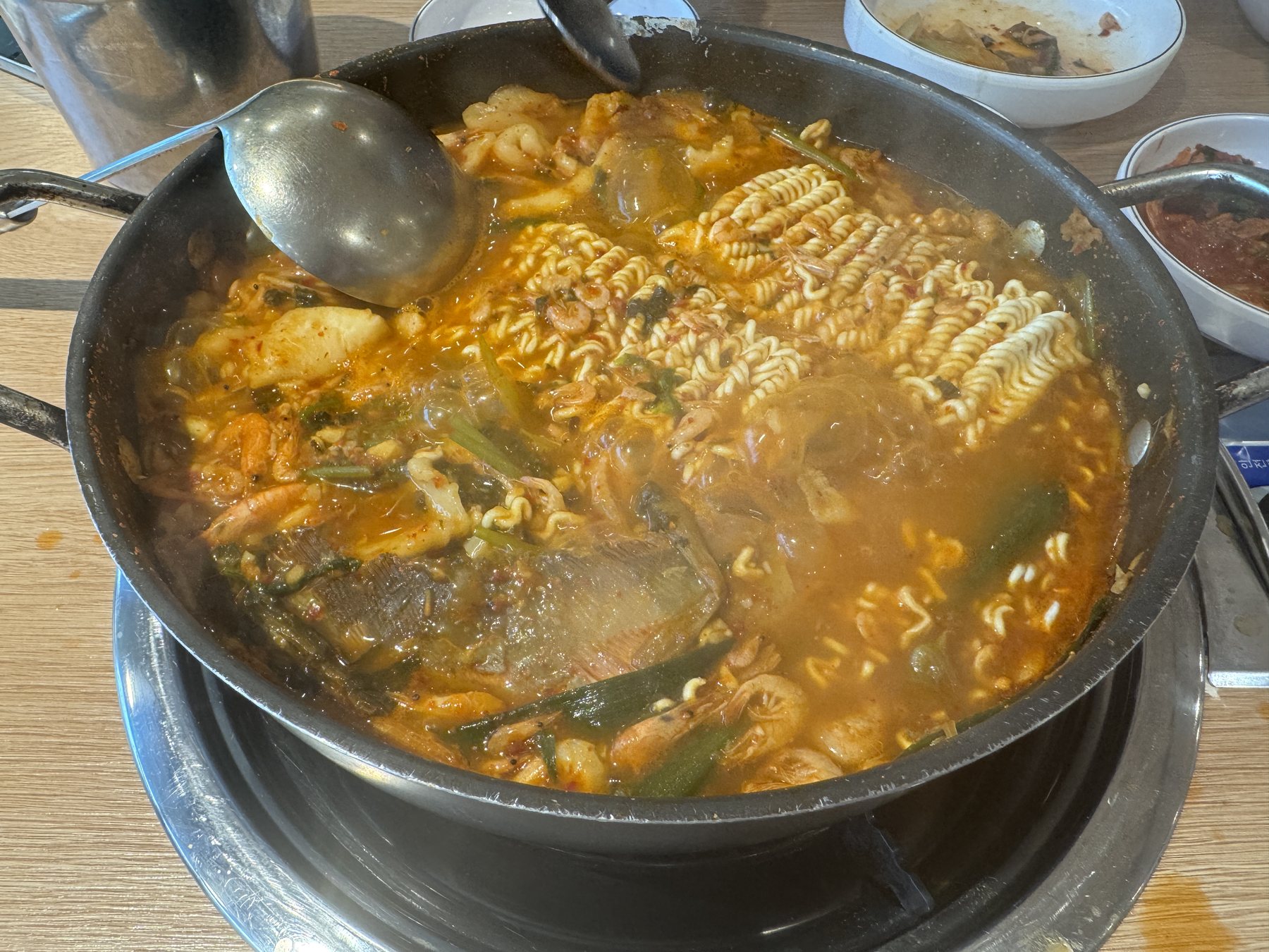 Ramyeon noodles going into the pot